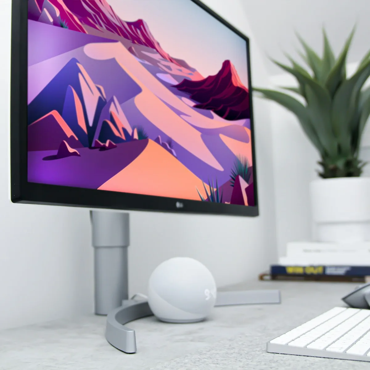 black flat screen tv turned on near white apple keyboard