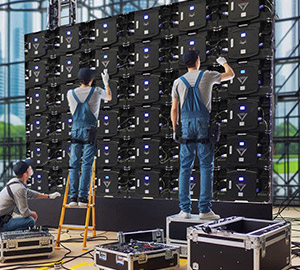 Technicians working on LED video wall installation