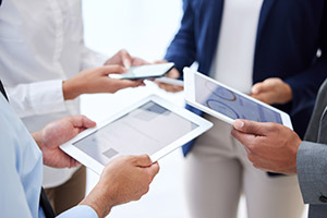 Professionals comparing chart data on iPads