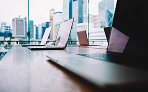 A MacBook Pro on a business desk setup for productivity.